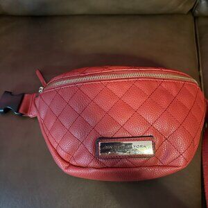 Andrew Marc belt bag in a bold red quilted leather design